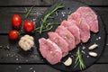 Raw boneless pork chops, vegetables, herbs and spices Royalty Free Stock Photo