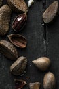Raw Brazil and Pecan nuts in shell on Wooden Rustic table Royalty Free Stock Photo