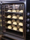 Raw bread on a baking sheet ready for baking. Royalty Free Stock Photo