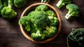 Fresh green broccoli in wooden bowl on wooden background. Top view. Royalty Free Stock Photo