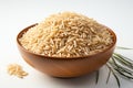 Raw brown rice in a bowl on white background. Close up. Generative AI Royalty Free Stock Photo