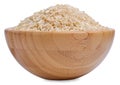 Raw brown rice in a wooden bowl isolated Royalty Free Stock Photo