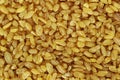 Raw bulgur wheat macro background