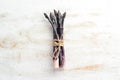 Raw Bunch of purple asparagus on a white wooden background. Healthy food. Top view, free copy space Royalty Free Stock Photo