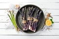 Raw Bunch of purple asparagus on a white wooden background. Healthy food. Top view, free copy space Royalty Free Stock Photo