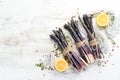 Raw Bunch of purple asparagus on a white wooden background. Healthy food. Top view, free copy space Royalty Free Stock Photo