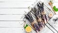 Raw Bunch of purple asparagus on a white wooden background. Healthy food. Top view, free copy space Royalty Free Stock Photo