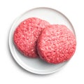 Raw burger beef patties on plate isolated on white background Royalty Free Stock Photo
