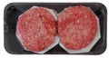 Raw burger patties in black styrofoam container