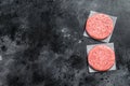 Raw Burger patties, ground beef meat. Black background. Top view. Copy space Royalty Free Stock Photo