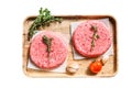 Raw Burger patties. Mince meat cutlet, ground beef and pork. Isolated on white background. Top view. Royalty Free Stock Photo