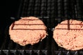 Raw burgers on bbq barbecue grill with fire. Food meat - raw burgers on bbq barbecue grill with fire. Shallow dof Royalty Free Stock Photo