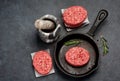 Raw burgers cutlets from beef meat with with pepper and rosemary