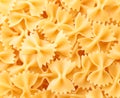 Raw butterflies pasta background. The view from top Royalty Free Stock Photo