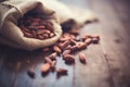 raw cacao beans in a rustic burlap sack Royalty Free Stock Photo