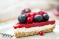 Raw cake with berries, vegan dessert with fresh berries closeup