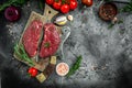Raw cap rump steak or top sirloin beef meat steak on black background. banner, menu, recipe place for text, top view Royalty Free Stock Photo