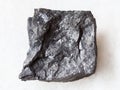 raw carbonaceous shale stone on white