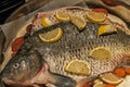 Raw carp fish prepared to roast in oven