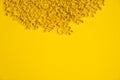 raw Cavatappi Cellentani noodles pasta italian food macro on yellow background