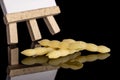 Raw cavatelli pasta isolated on black glass