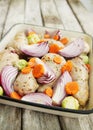 Raw chicken on a baking pan Royalty Free Stock Photo
