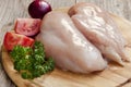 Raw chicken breast on cutting board Royalty Free Stock Photo