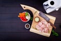 Raw chicken breast fillets on wooden cutting board with herbs and spices. Royalty Free Stock Photo
