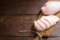 Raw chicken breast fillets on wooden cutting board. Royalty Free Stock Photo