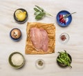 Raw chicken breast with lemon, herbs, pepper, peas, rice, onions, mustard wooden rustic background top view close up Royalty Free Stock Photo