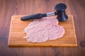 Raw chicken breast and meat mallet Royalty Free Stock Photo