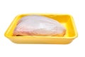 Raw chicken breast with skin in a yellow plastic container. Poultry meat in tray. Isolated on white background Royalty Free Stock Photo