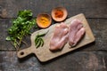 Raw chicken breast slab on wooden platter Royalty Free Stock Photo