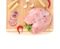 Raw chicken breast on wooden platter. Royalty Free Stock Photo