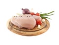 Raw chicken breasts on wooden cutting board with vegetable, isolated on white background Royalty Free Stock Photo
