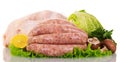 Raw chicken carcass, of sausage lettuce, mushrooms, lemon and cabbage. Royalty Free Stock Photo