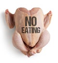 Raw chicken with conceptual message for vegans