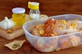 Raw chicken drumsticks with spices, olive oil, garlic, salt prepared for frying. Ingredients for cooking meat Royalty Free Stock Photo