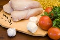 Raw chicken fillets , cheese, pasta and vegetables Royalty Free Stock Photo