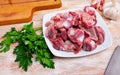 Raw chicken gizzards with greens and spices Royalty Free Stock Photo