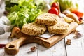 Raw chicken hamburger cutlet breaded with paprika and garlic. Homemade minced poultry cutlet with spices. Fresh lettuce leaves Royalty Free Stock Photo