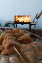 Raw chicken kebab before cooking on metal skewer. Grill on charcoal and flame, picnic, street food. BBQ fresh meat chop slices. Royalty Free Stock Photo