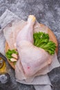 Raw chicken leg on cutting board Royalty Free Stock Photo