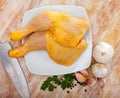 Raw chicken leg quarters on wooden table Royalty Free Stock Photo