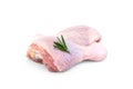 Raw chicken leg with rosemary isolated on white background. Royalty Free Stock Photo