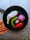 Chicken leg with vegetables on gray cement background