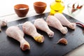 Raw chicken legs on a blackboard Royalty Free Stock Photo