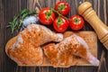 Raw chicken legs on a cutting board on a wooden table Royalty Free Stock Photo