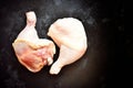 Raw chicken legs on a dark concrete table isolated background. Two chicken raw fresh thighs. Top view, place for text Royalty Free Stock Photo