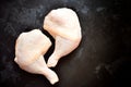 Raw chicken legs on a dark concrete table isolated background. Two chicken raw fresh thighs. Top view, place for text Royalty Free Stock Photo